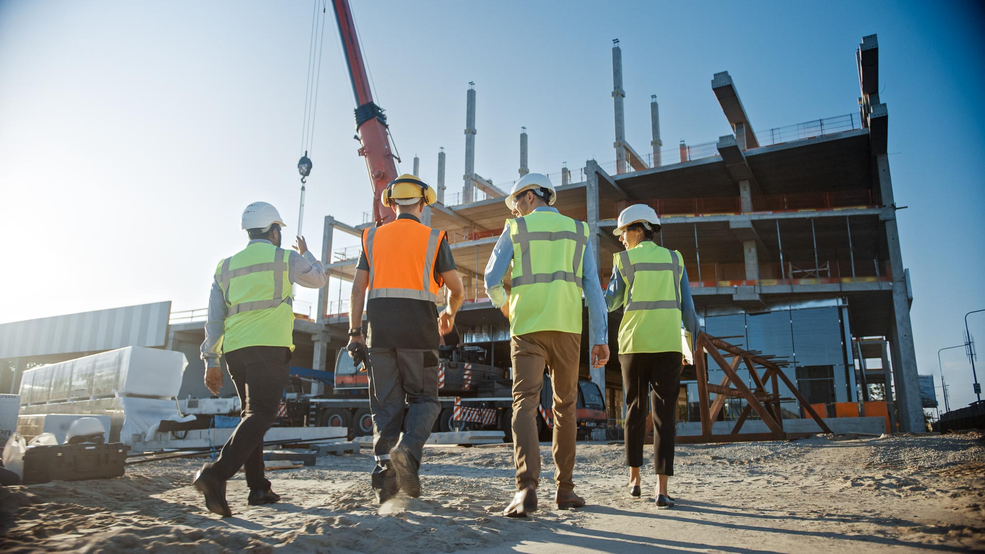 Diverse Team Of Specialists Inspect Commercial, Industrial Build